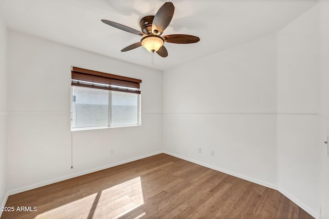 8009 W Salter Dr, Peoria, AZ 85382 - empty room featuring wood finished floors, ceiling fan, and baseboards
