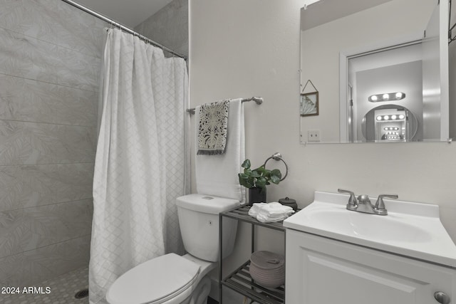 bathroom featuring a shower with shower curtain, vanity, and toilet