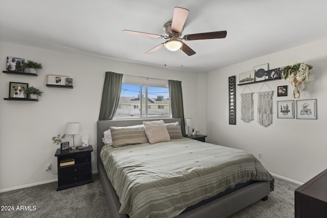 bedroom with dark colored carpet and ceiling fan