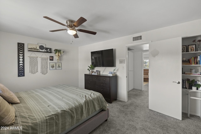 bedroom featuring light colored carpet and ceiling fan