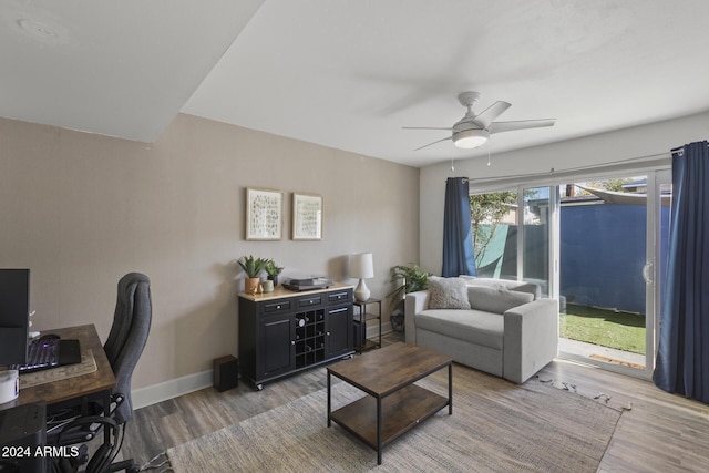 home office featuring ceiling fan, plenty of natural light, and light hardwood / wood-style floors