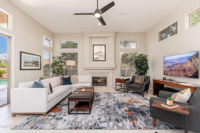living room featuring tile patterned floors, ceiling fan, a fireplace, and recessed lighting