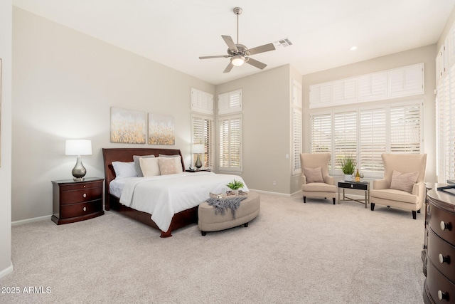 carpeted bedroom with baseboards, visible vents, and ceiling fan