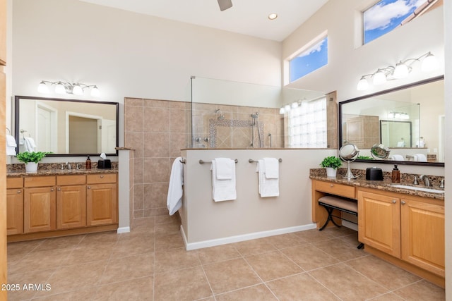 full bathroom with a walk in shower, tile patterned floors, and a sink