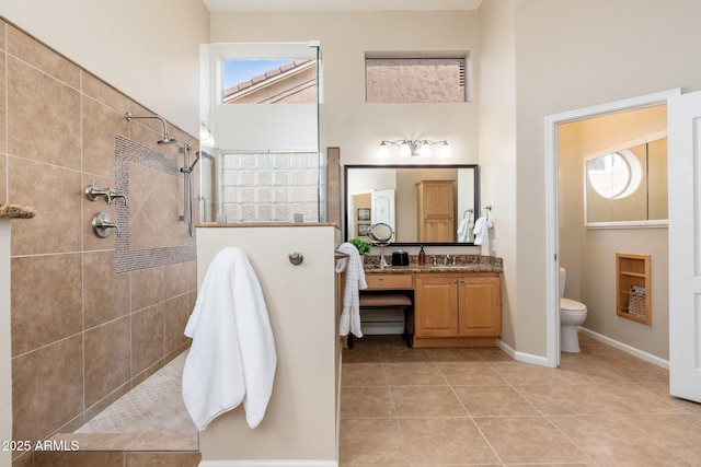 full bathroom with walk in shower, tile patterned floors, a wealth of natural light, and toilet
