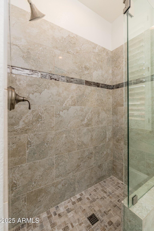 bathroom with a shower stall
