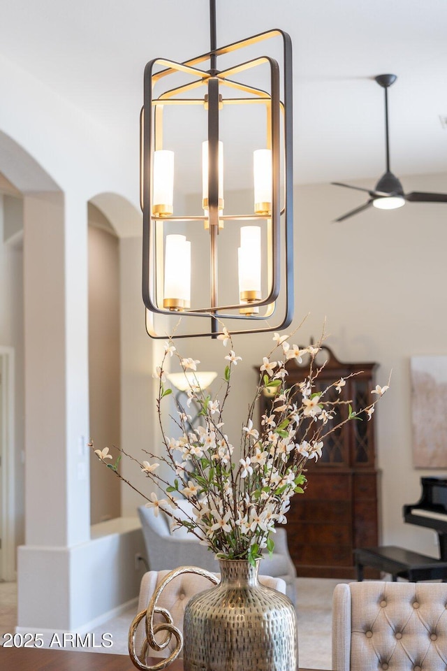 room details with arched walkways and ceiling fan