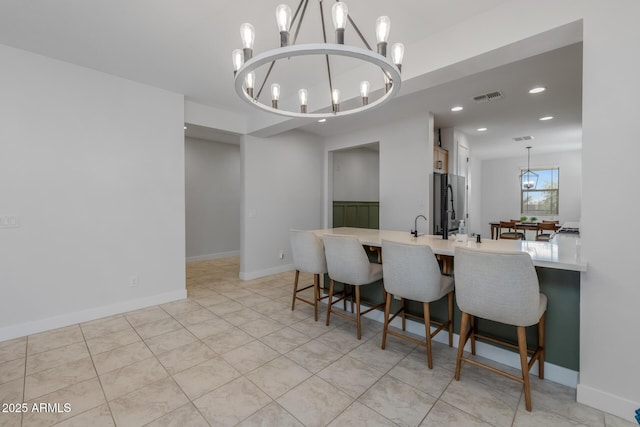 dining area featuring baseboards, a chandelier, recessed lighting, light tile patterned flooring, and visible vents
