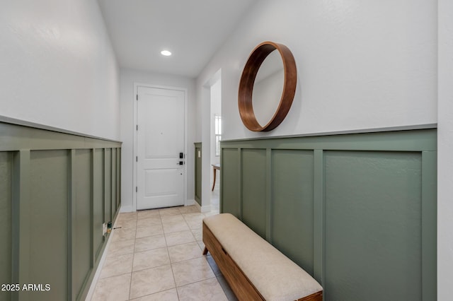 doorway to outside featuring recessed lighting and light tile patterned floors