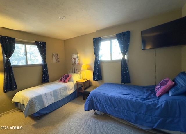 carpeted bedroom with a textured ceiling