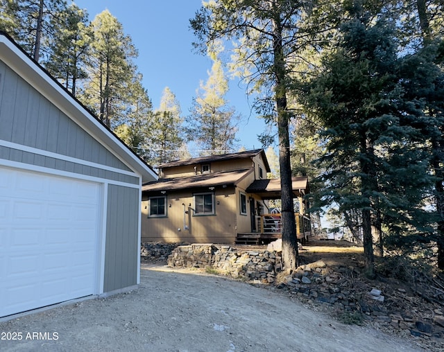 view of side of home featuring a garage