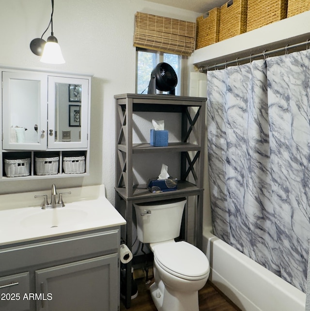 full bathroom featuring hardwood / wood-style flooring, vanity, toilet, and shower / bath combo with shower curtain