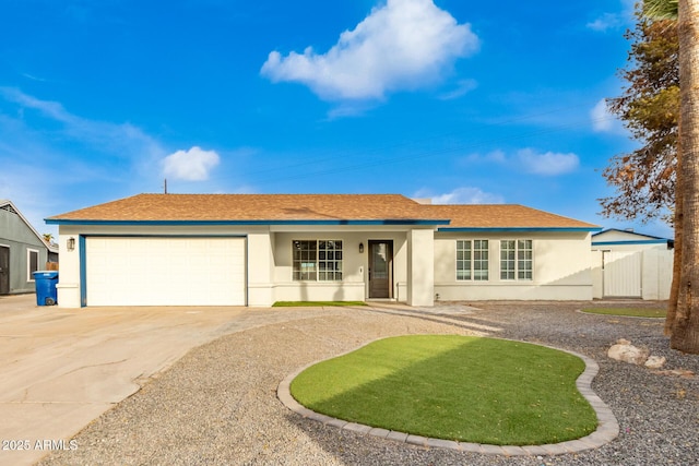 ranch-style home featuring a garage