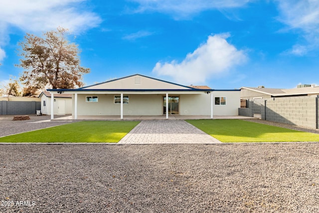 view of front of home featuring a patio area and a front lawn