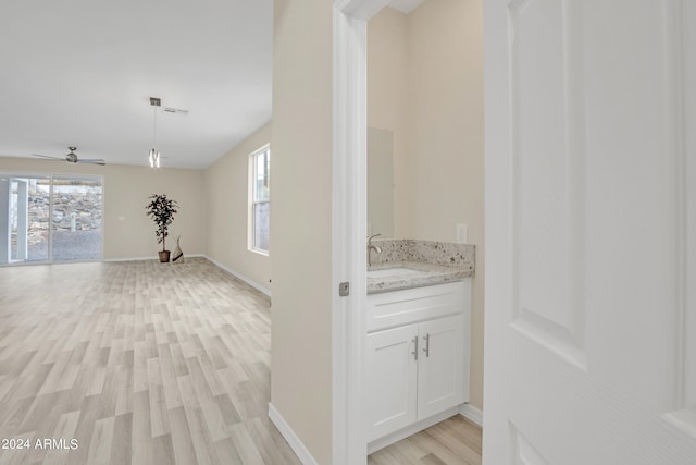 interior space with sink and light hardwood / wood-style floors