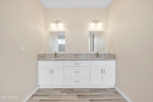 bathroom featuring vanity and hardwood / wood-style floors