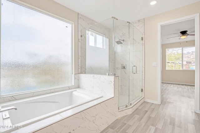 bathroom with hardwood / wood-style floors, plus walk in shower, and ceiling fan