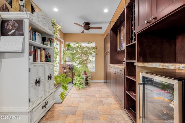 kitchen featuring ceiling fan and beverage cooler