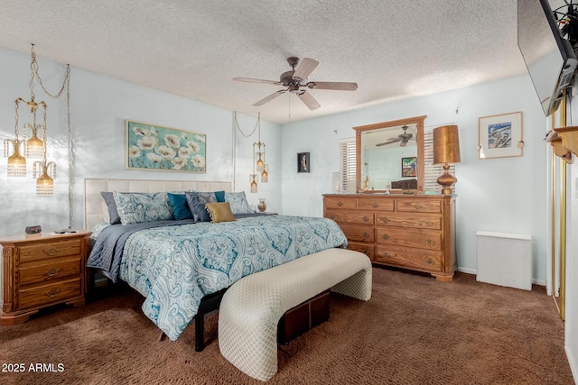 carpeted bedroom featuring ceiling fan and a textured ceiling