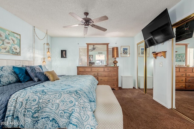 carpeted bedroom featuring a textured ceiling, a closet, and ceiling fan