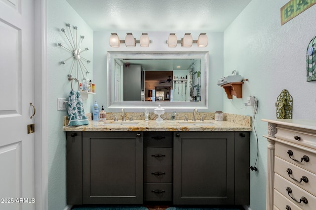 bathroom featuring vanity and a textured ceiling