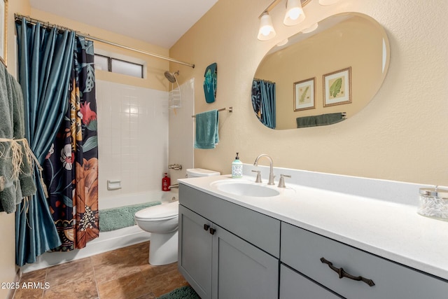 full bathroom with vanity, shower / bath combination with curtain, and toilet