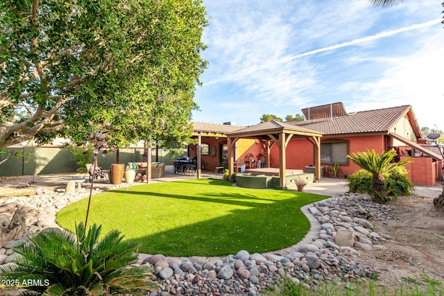 rear view of property with an outdoor living space, a yard, and a patio area