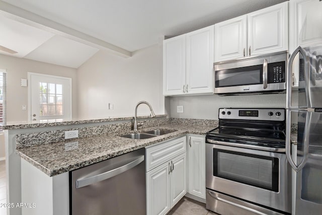2301 E University Dr Unit 172, Mesa, AZ 85213 - kitchen featuring stainless steel appliances, a sink, a peninsula, light stone countertops, and white cabinets