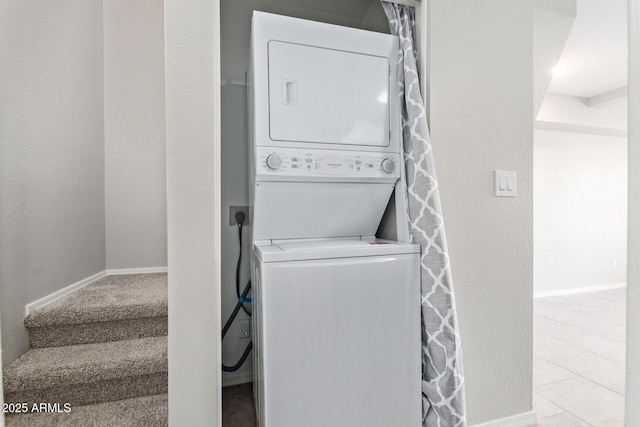 2301 E University Dr Unit 172, Mesa, AZ 85213 - laundry area featuring stacked washer and clothes dryer and baseboards