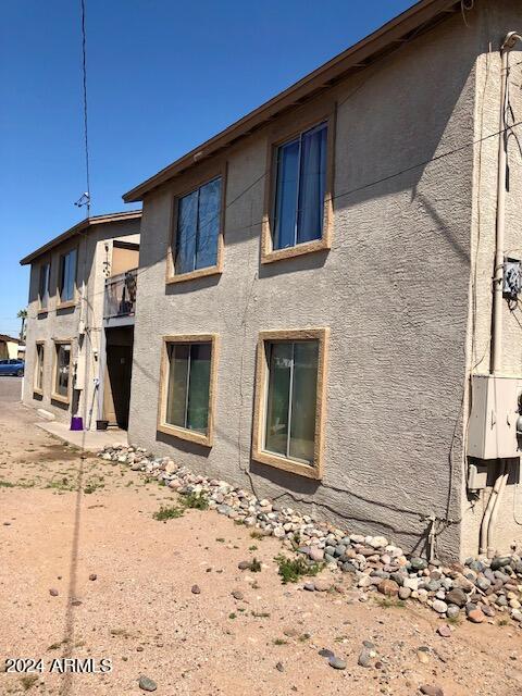 back of house with stucco siding