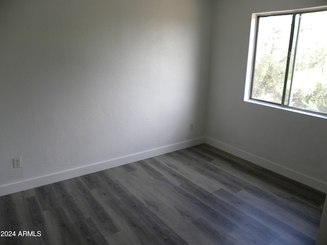 spare room featuring dark hardwood / wood-style flooring