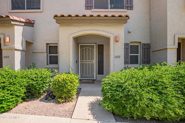 1961 N Hartford St Unit 1092, Chandler, AZ 85225 - view of exterior entry featuring stucco siding