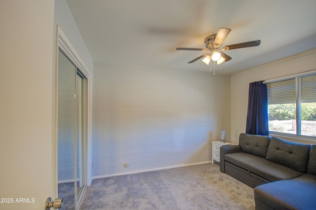 living room with carpet and a ceiling fan