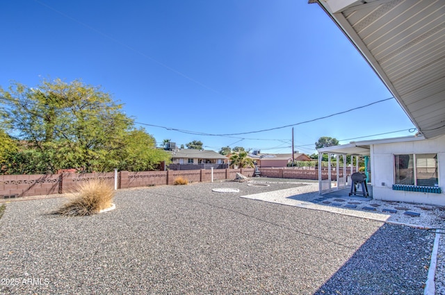 view of yard with a patio and fence private yard