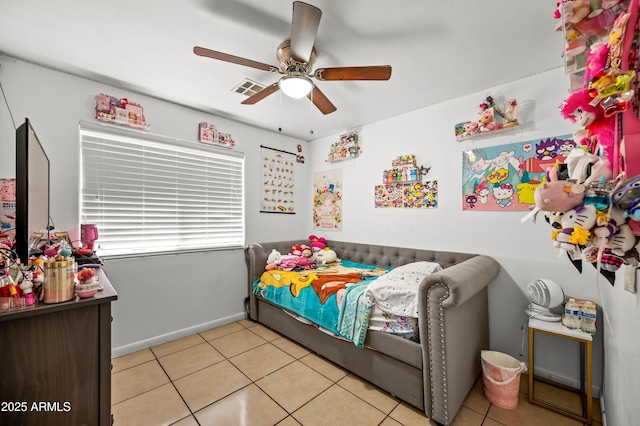 bedroom featuring a ceiling fan, visible vents, baseboards, and light tile patterned floors