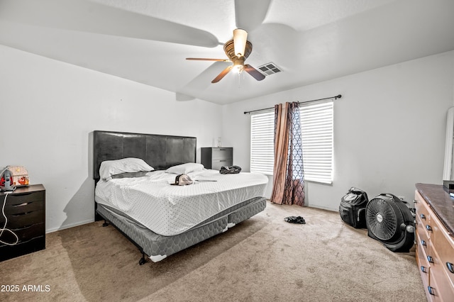 carpeted bedroom featuring visible vents and a ceiling fan