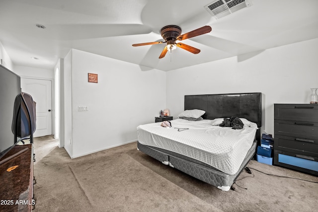 bedroom with carpet, visible vents, and a ceiling fan