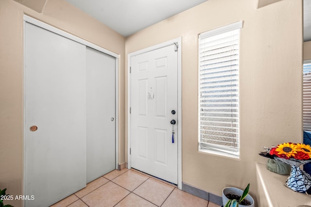 entrance foyer with light tile patterned flooring