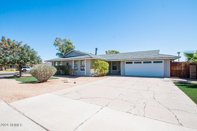 ranch-style house featuring a garage