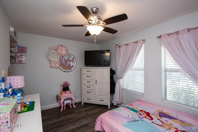 bedroom with dark wood-type flooring, multiple windows, and ceiling fan