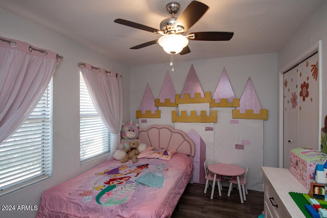 bedroom featuring dark hardwood / wood-style floors and ceiling fan