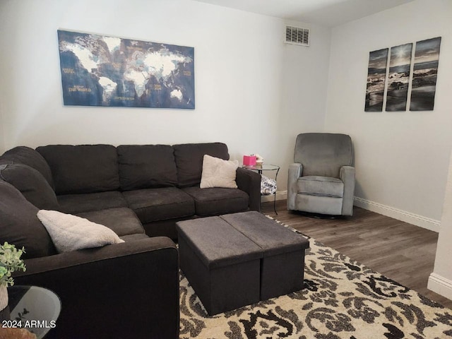 living room featuring dark hardwood / wood-style flooring