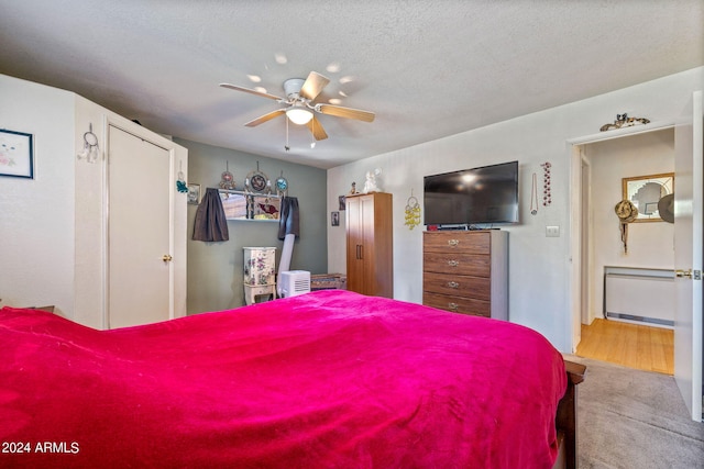 1987 Stagg Run, Overgaard, AZ 85933 - bedroom featuring ceiling fan, carpet floors, and a textured ceiling