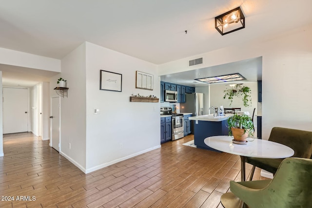 interior space with sink and light wood-type flooring