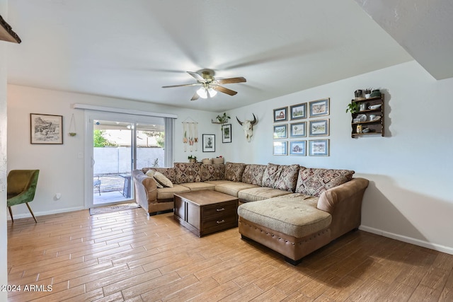 living room with ceiling fan and light hardwood / wood-style flooring