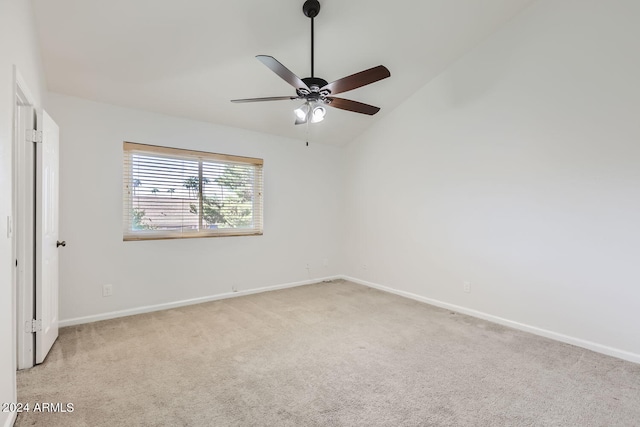 empty room with light carpet, lofted ceiling, and ceiling fan