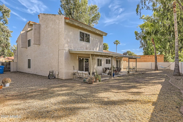 back of house featuring a patio area