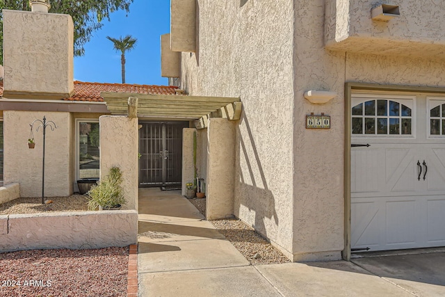 property entrance featuring a garage