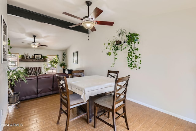 dining space featuring light hardwood / wood-style floors and ceiling fan