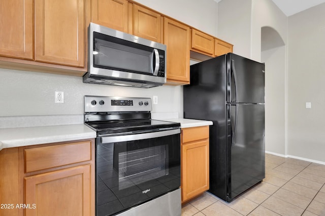 1422 E Ebony Dr, Chandler, AZ 85286 - kitchen featuring light tile patterned floors, light countertops, baseboards, and stainless steel appliances